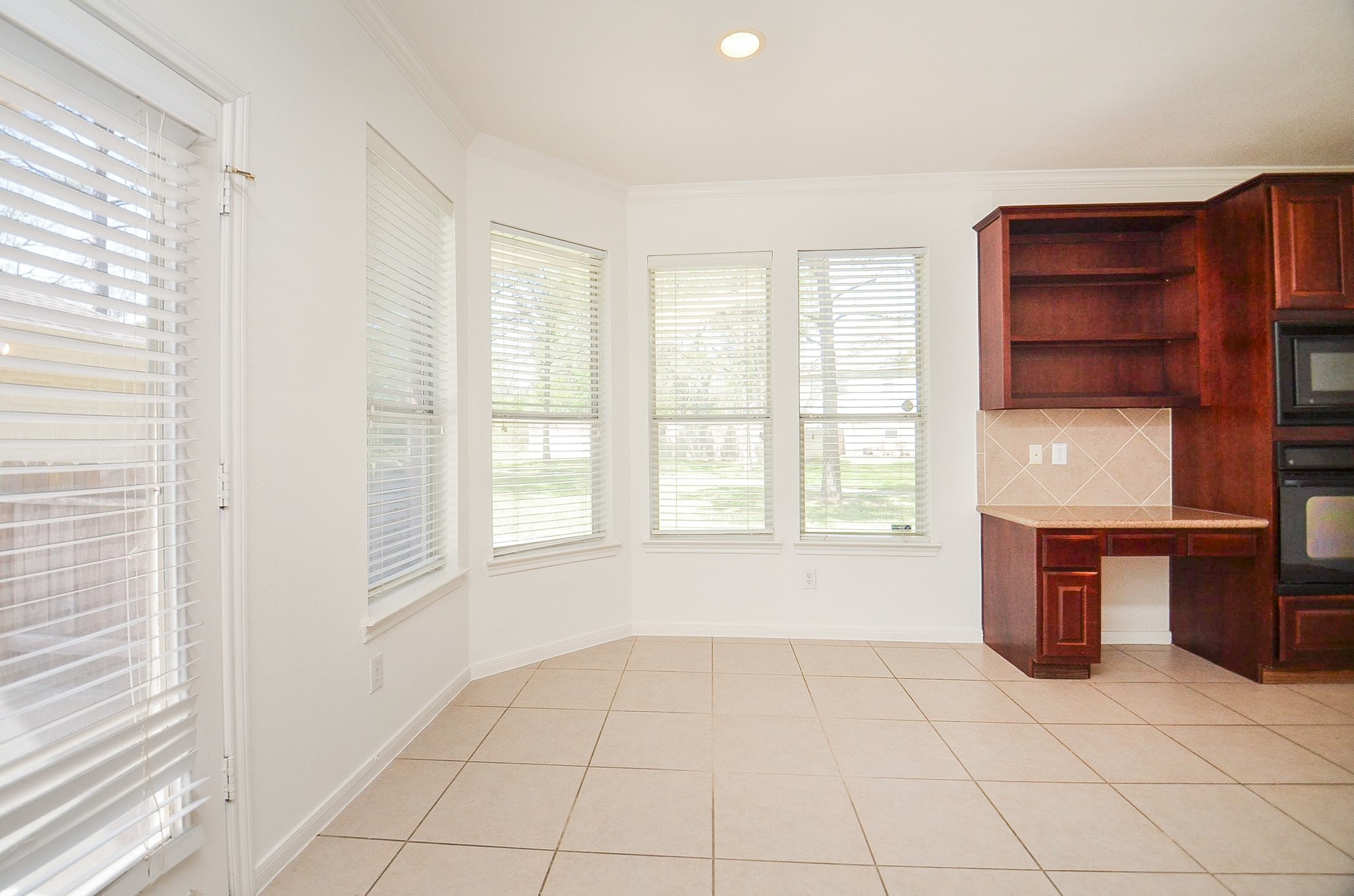 23615 Banning Point Court Katy, TX 77494 - Photo 24 of 50 a view of an empty room with a fireplace and a window