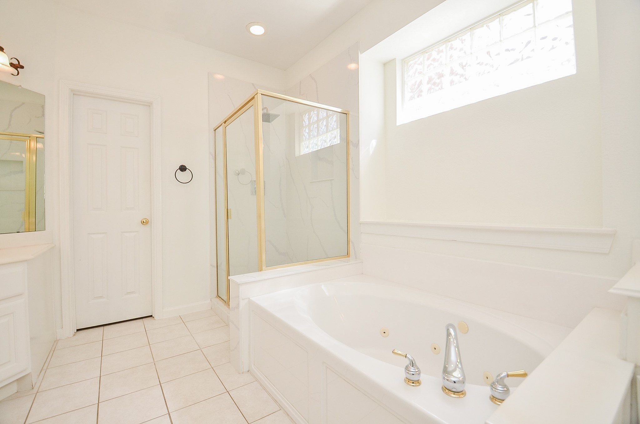 23615 Banning Point Court Katy, TX 77494 - Photo 30 of 50 a bathroom with a bathtub and a shower