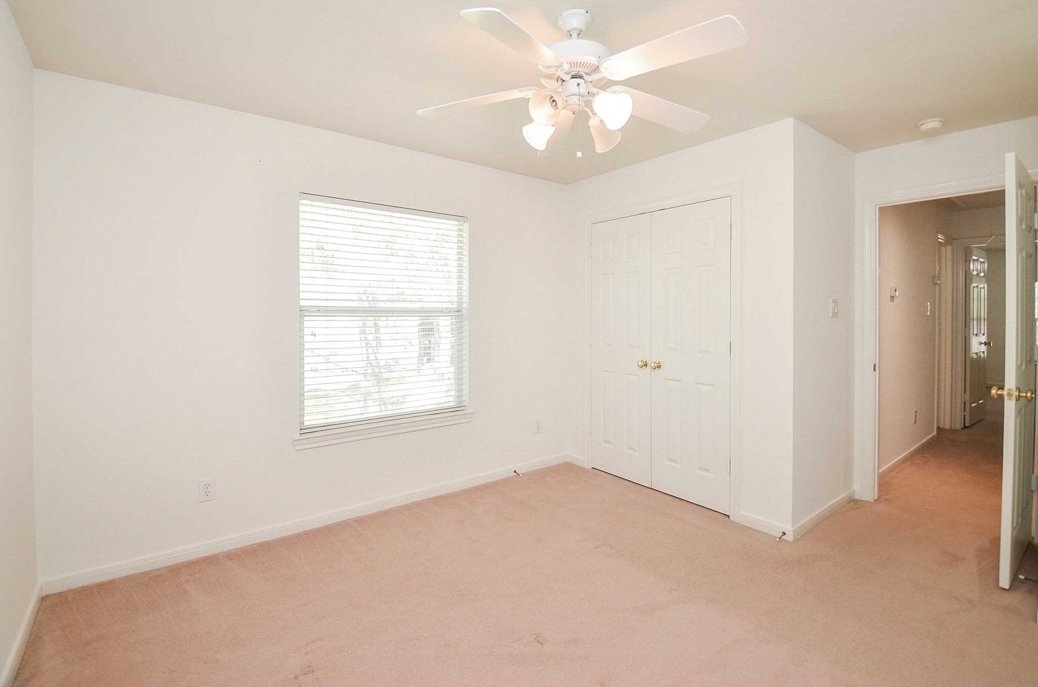 23615 Banning Point Court Katy, TX 77494 - Photo 38 of 50 an empty room with a window and a fan