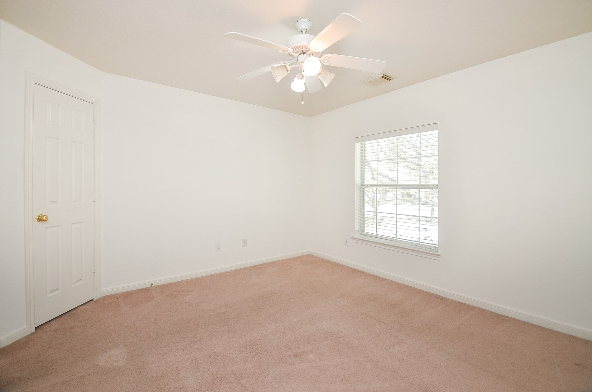 23615 Banning Point Court Katy, TX 77494 - Photo 39 of 50 an empty room with windows and chandelier fan