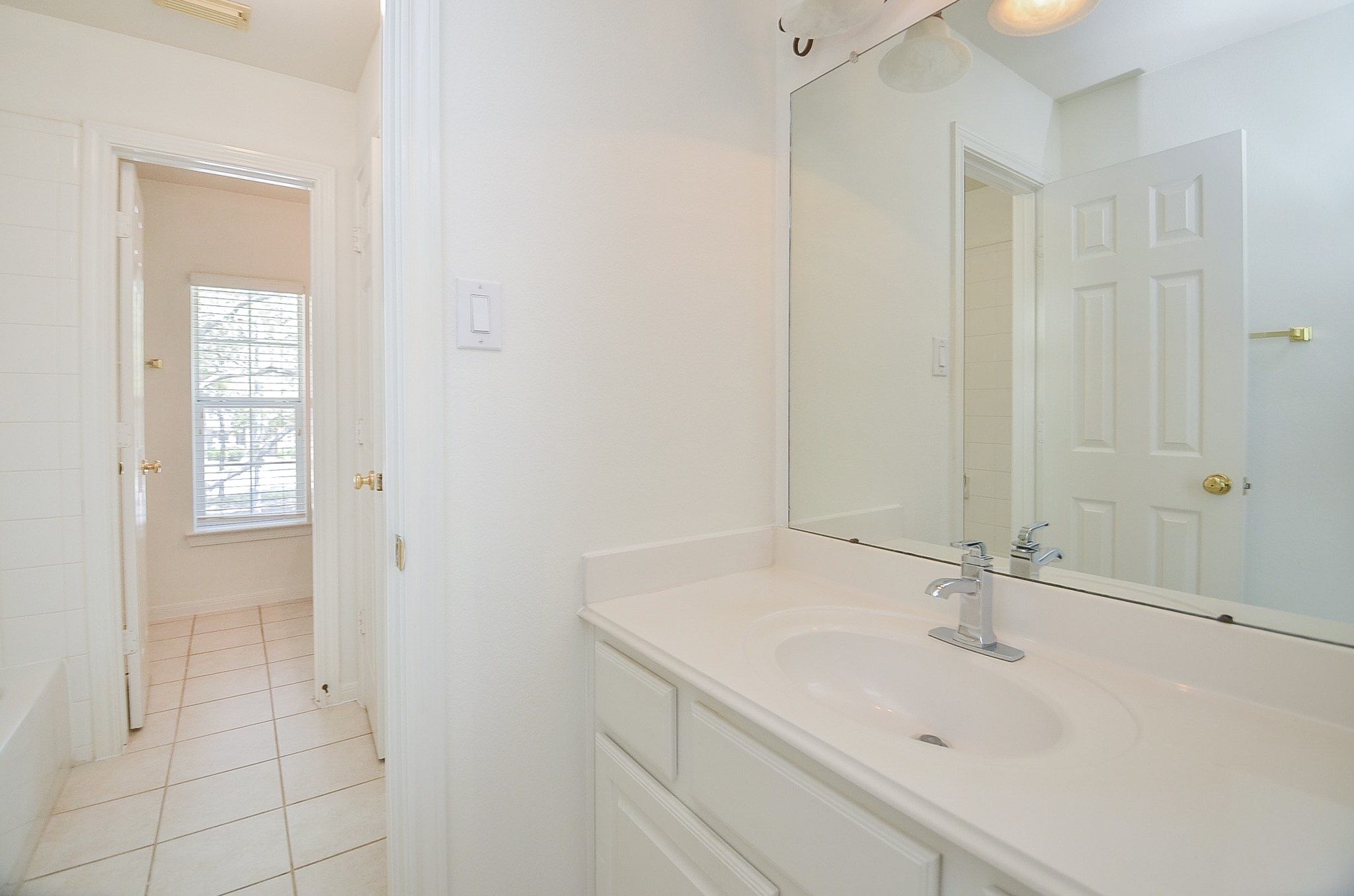 23615 Banning Point Court Katy, TX 77494 - Photo 41 of 50 a bathroom with a sink and a mirror