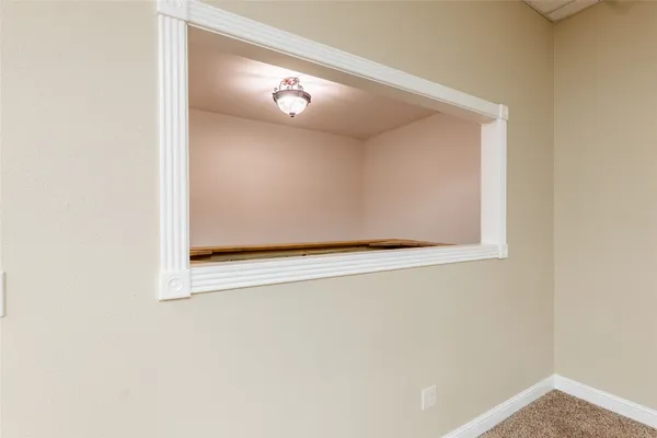 an empty room with a empty space and windows