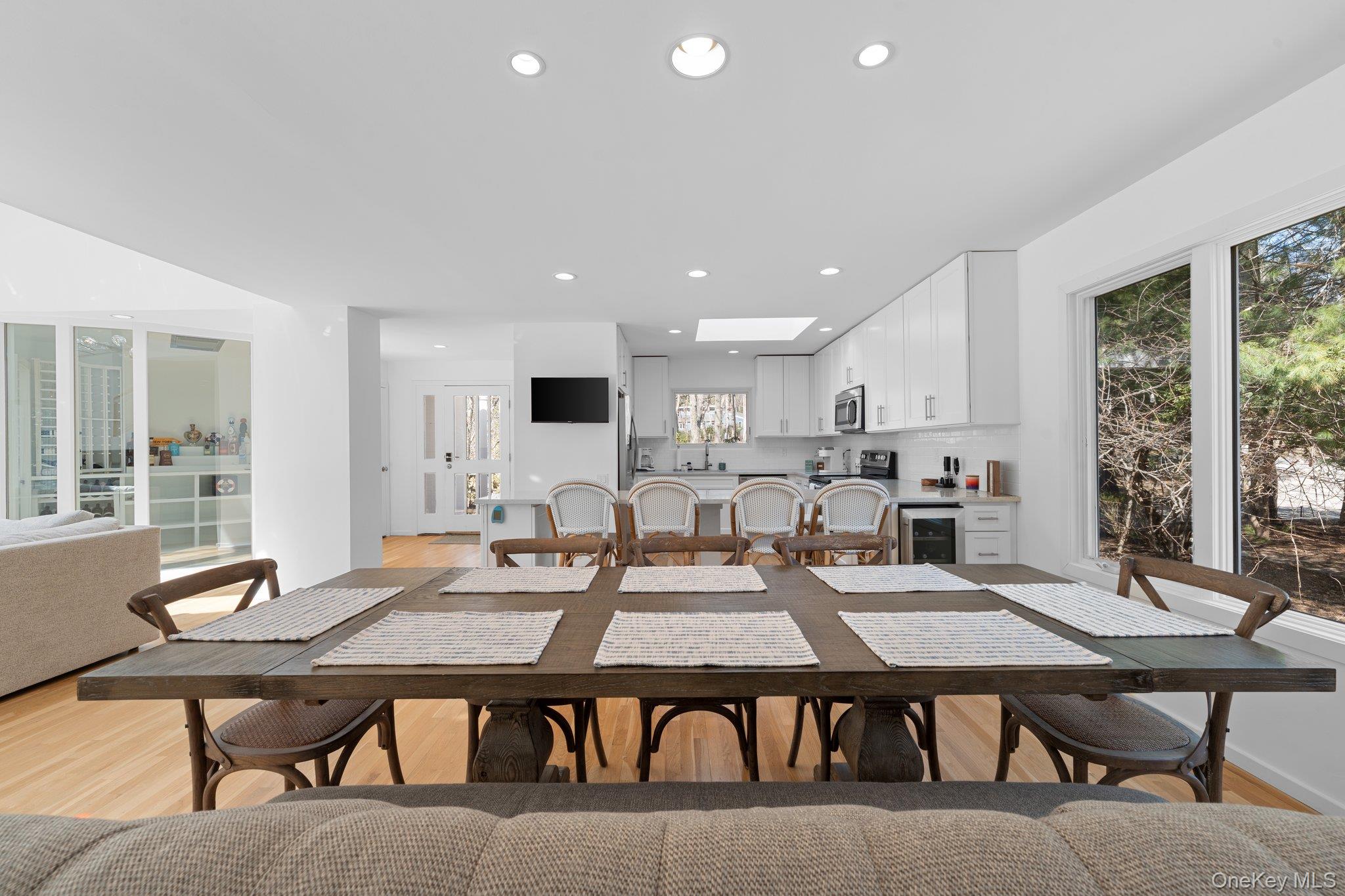 35 Ely Brook Road East Hampton, NY 11937 - Photo 13 of 32 a living room with stainless steel appliances furniture dining table and a large window