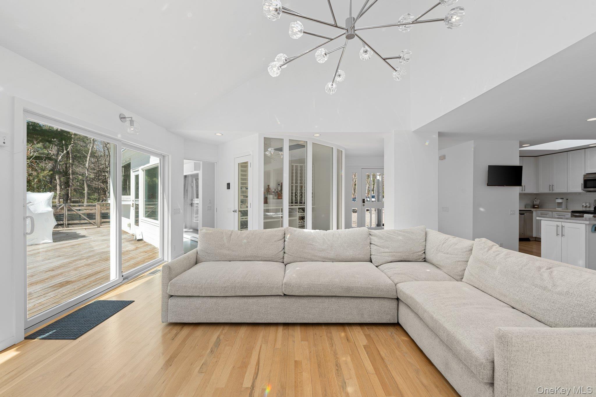 35 Ely Brook Road East Hampton, NY 11937 - Photo 18 of 32 a living room with furniture and a large window