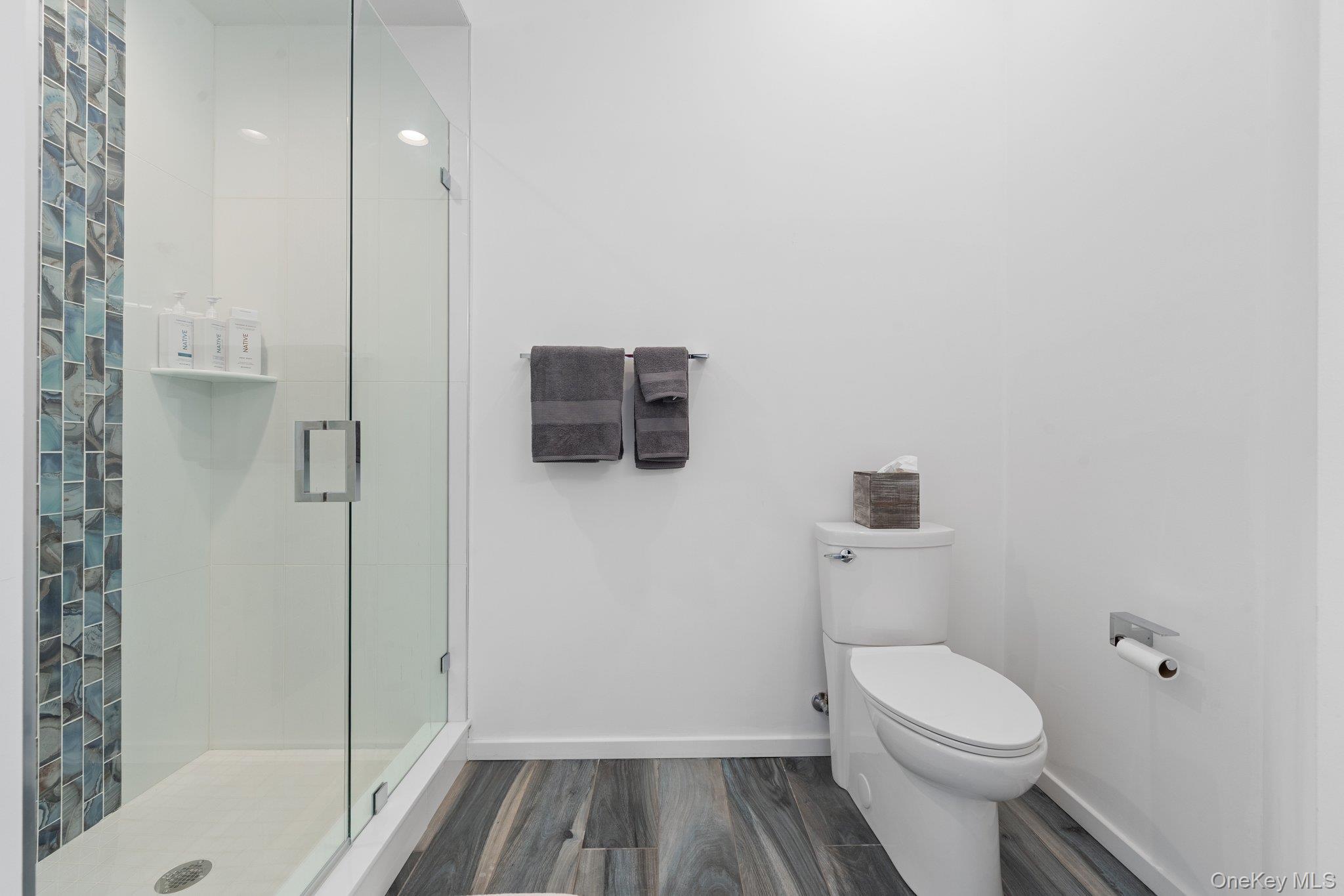 35 Ely Brook Road East Hampton, NY 11937 - Photo 28 of 32 a bathroom with a sink and toilet