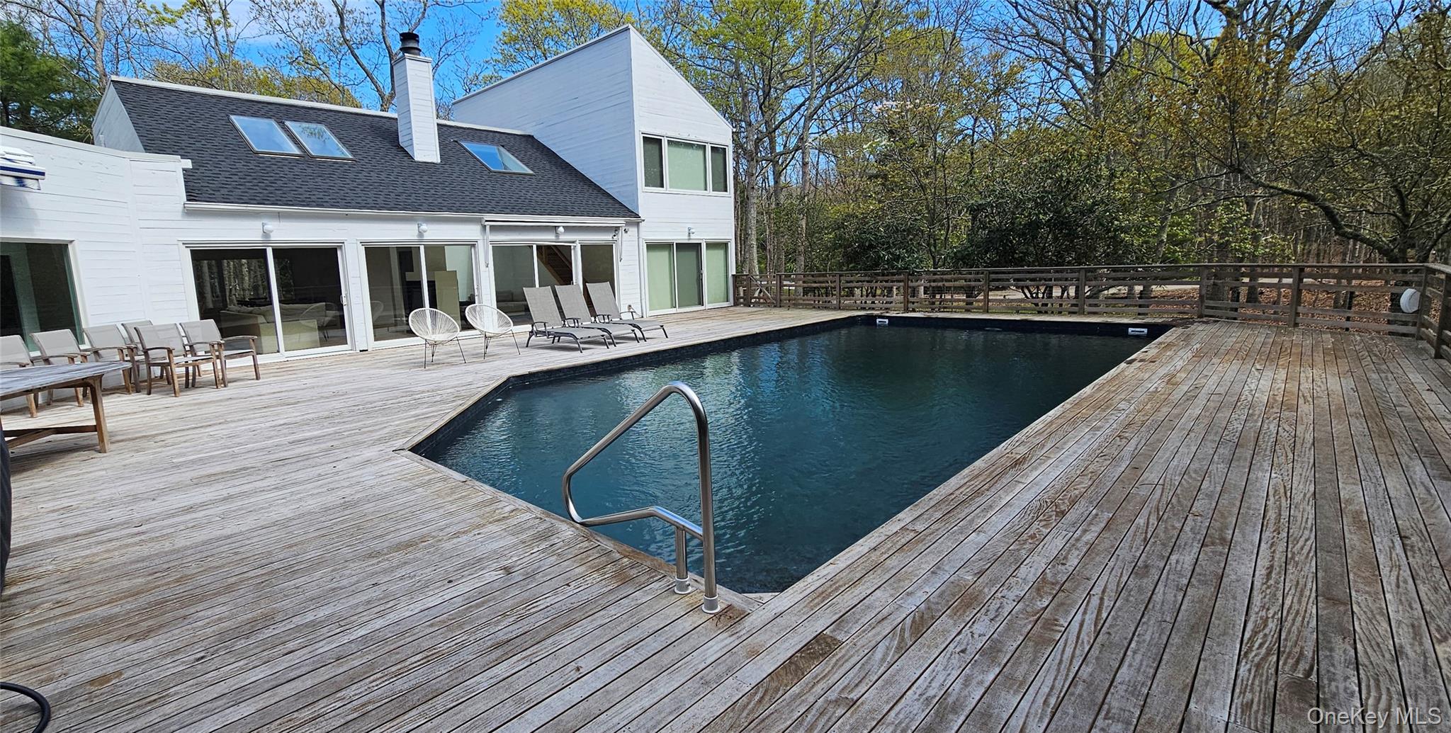 35 Ely Brook Road East Hampton, NY 11937 - Photo 3 of 32 a view of a house with pool on roof deck