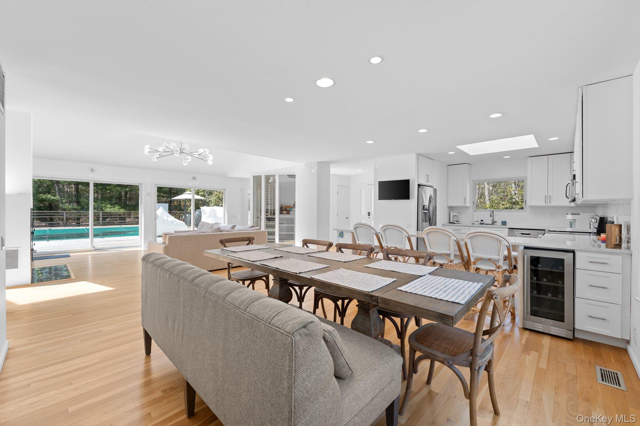 35 Ely Brook Road East Hampton, NY 11937 - Photo 5 of 32 a view of a dining room with furniture window and wooden floor