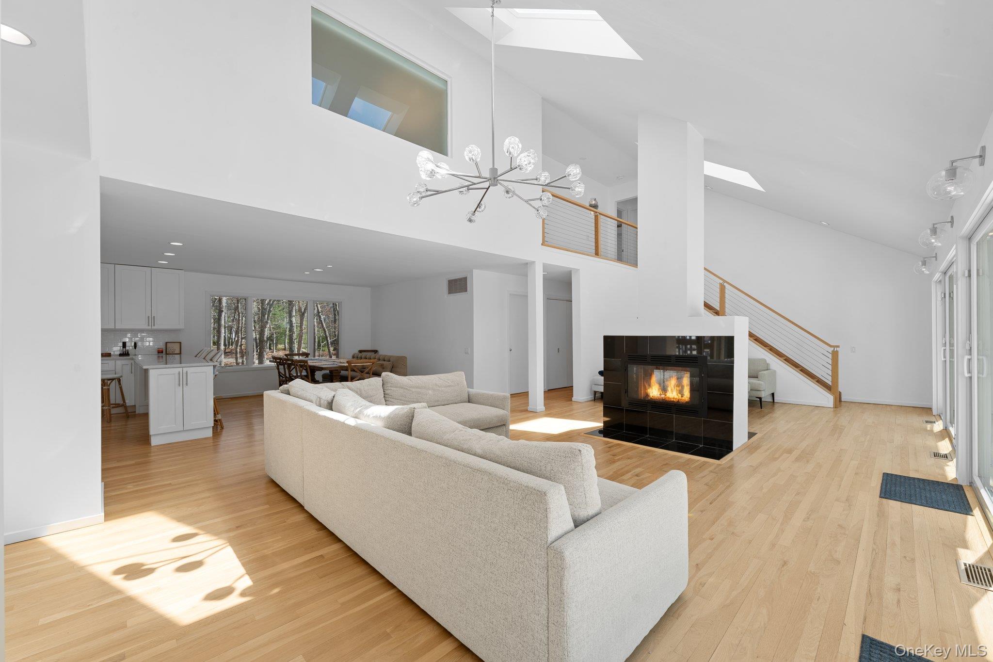 35 Ely Brook Road East Hampton, NY 11937 - Photo 6 of 32 a living room with furniture and a fireplace
