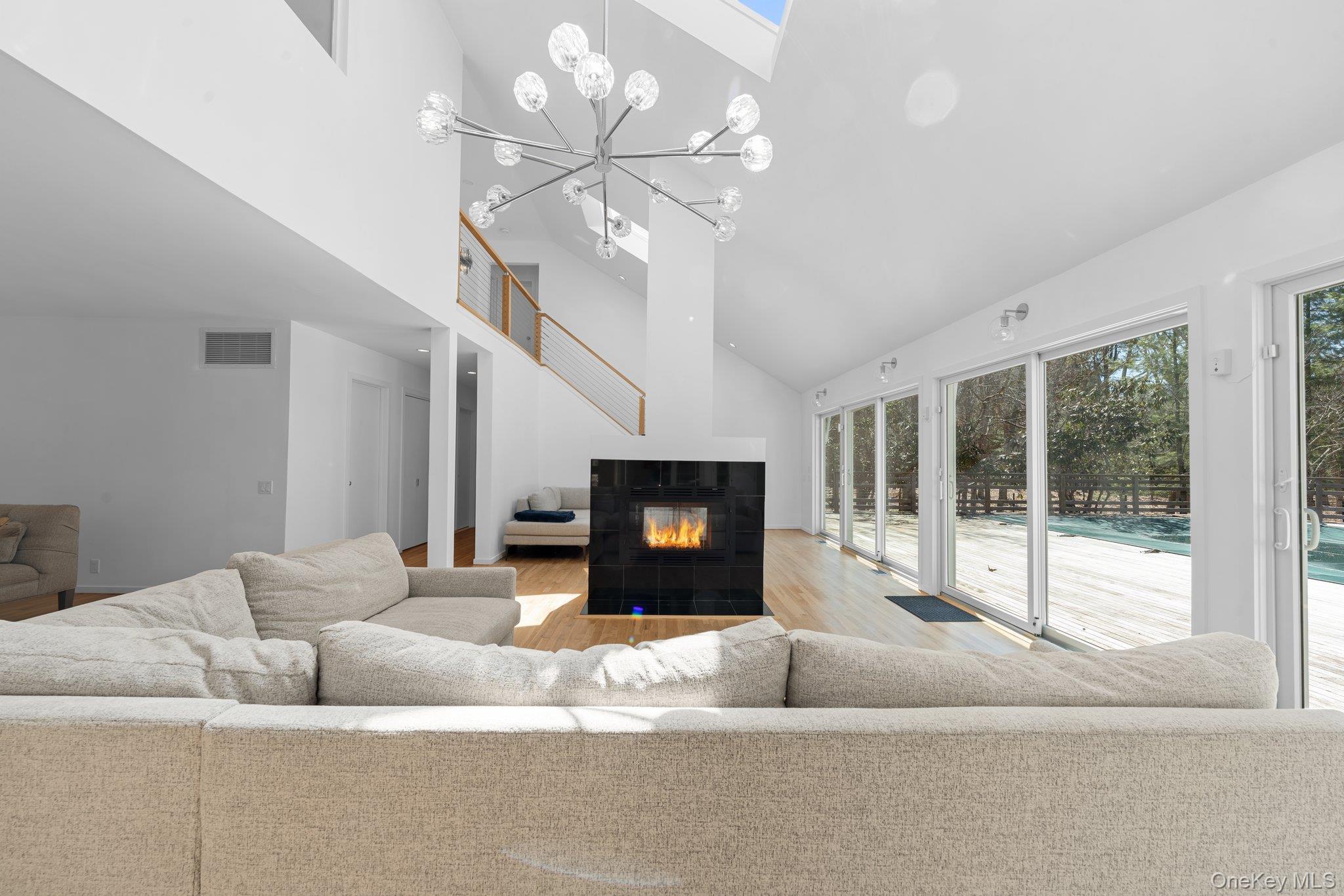 35 Ely Brook Road East Hampton, NY 11937 - Photo 7 of 32 a living room with furniture and a fireplace