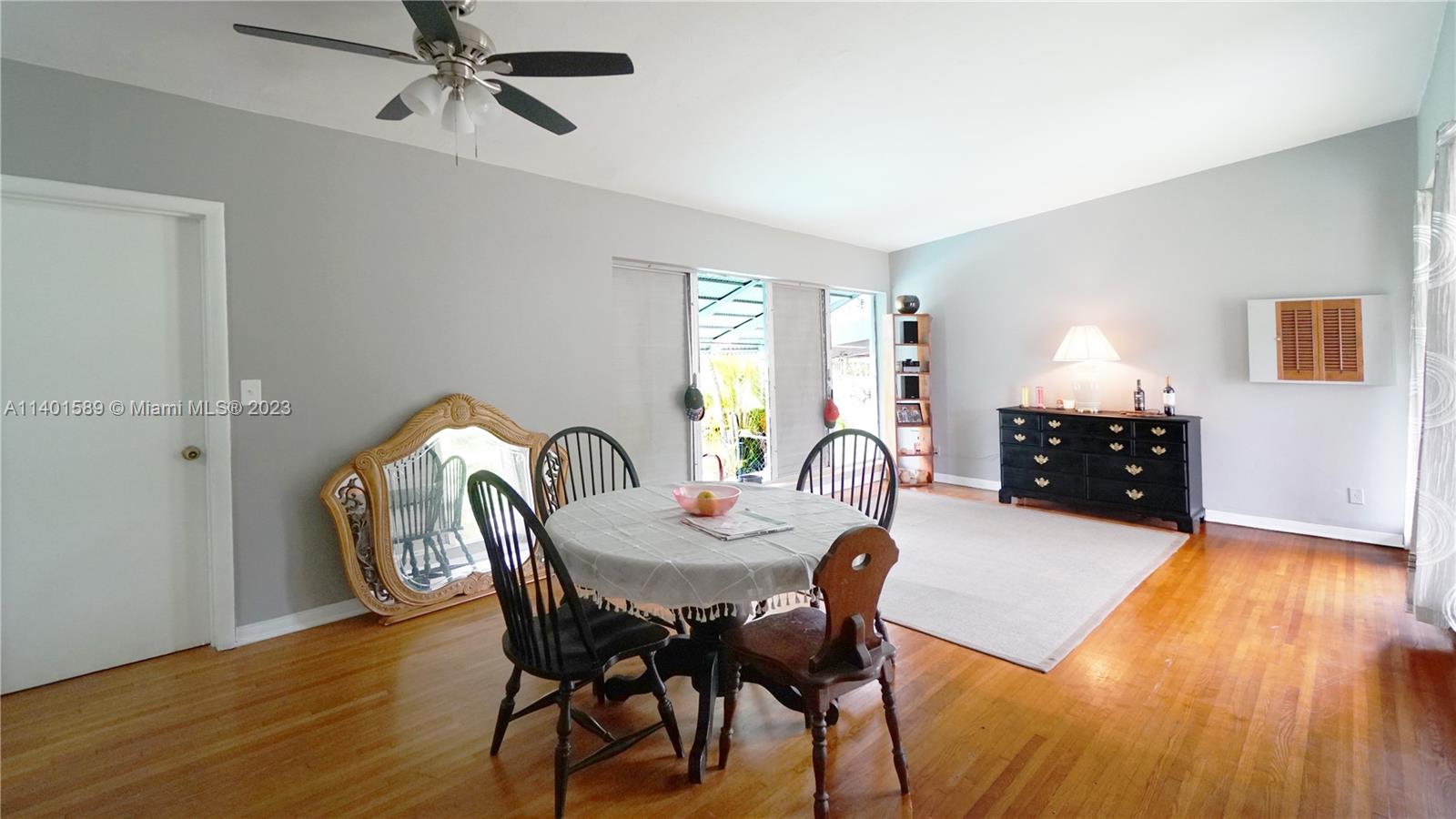 8480 Southwest 32nd Street Miami, FL 33155 - Photo 11 of 24 a dining room with furniture and wooden floor