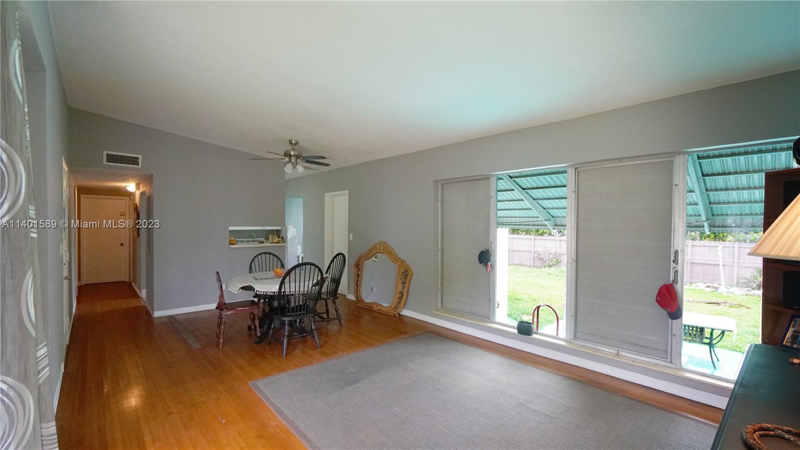8480 Southwest 32nd Street Miami, FL 33155 - Photo 12 of 24 a dining room with furniture and a large window