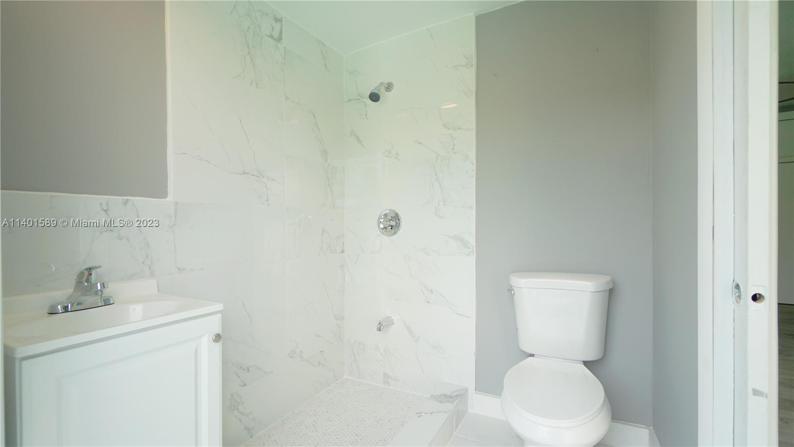 8480 Southwest 32nd Street Miami, FL 33155 - Photo 13 of 24 a bathroom with a toilet sink and shower