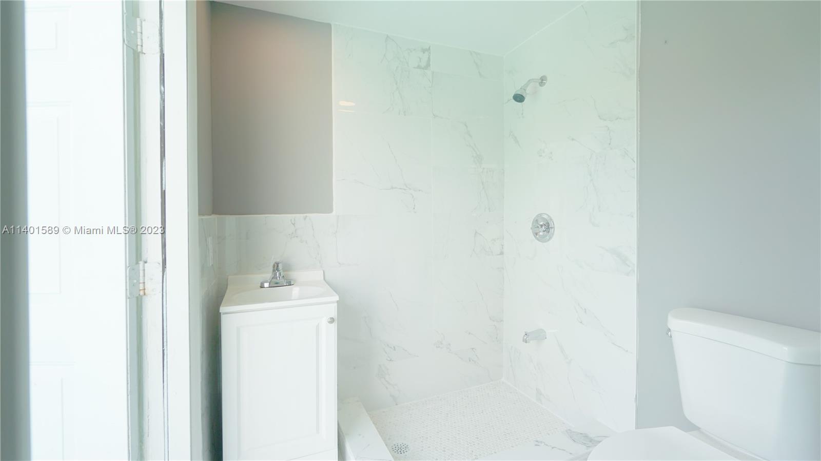 8480 Southwest 32nd Street Miami, FL 33155 - Photo 14 of 24 a bathroom with a sink toilet and shower