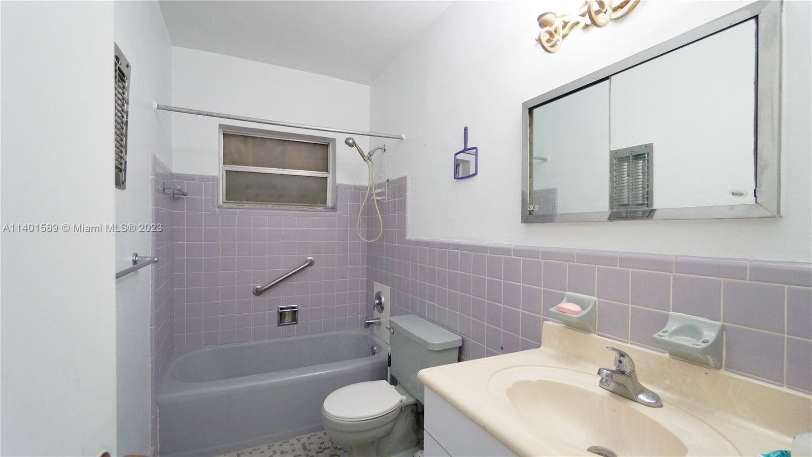 8480 Southwest 32nd Street Miami, FL 33155 - Photo 6 of 24 a bathroom with a sink toilet and shower