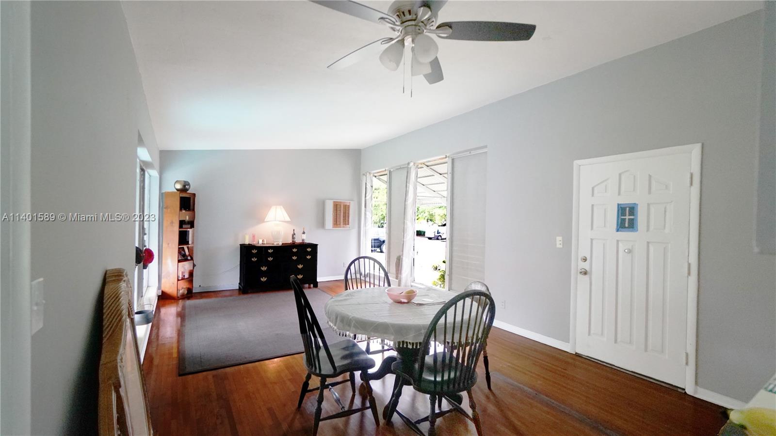 8480 Southwest 32nd Street Miami, FL 33155 - Photo 10 of 24 a view of a dining room with furniture and wooden floor