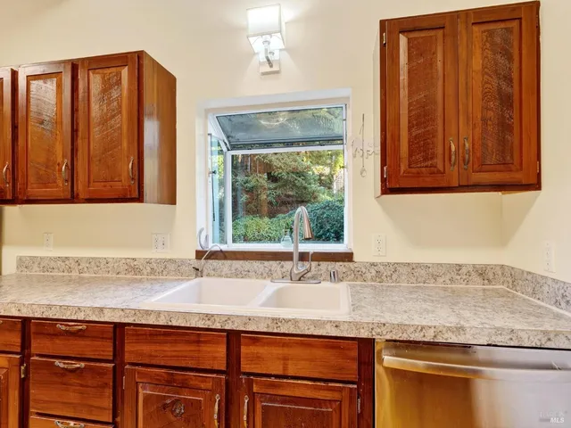 a view of a hallway with wooden floor and furniture