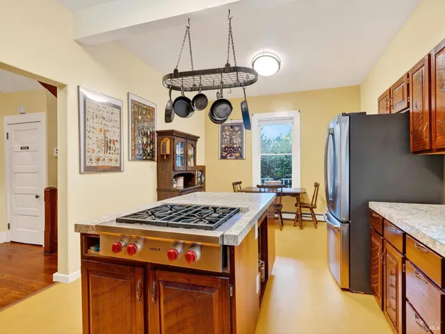 a bedroom with a bed a table and chair