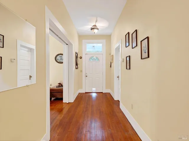 a bedroom with a bed and a large window with outer view