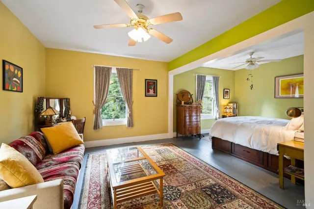 a bedroom with furniture and a window