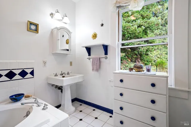 a bed room with a bed and a chandelier