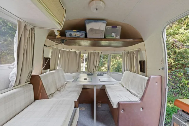 a view of backyard with a patio