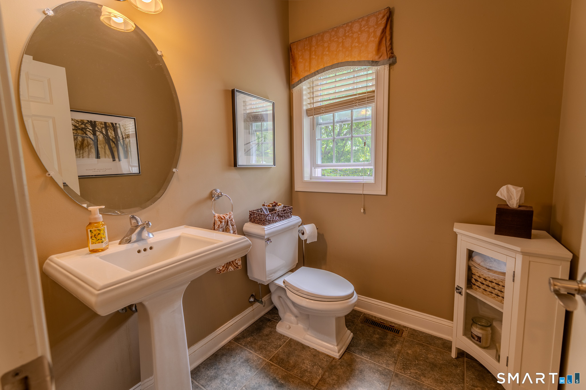 4 Ortense Road Wallingford, CT 06492 - Photo 16 of 33 a bathroom with a sink a toilet and a mirror