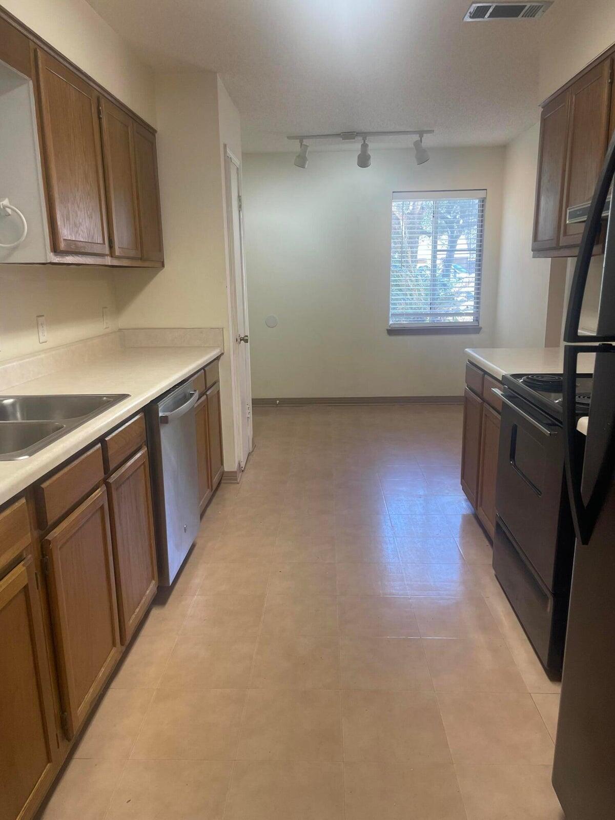 1105 Sean Lane Niceville, FL 32578 - Photo 6 of 16 a view of a kitchen with furniture and a window