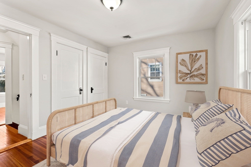 27 Hawthorn Road Milton, MA 02186 - Photo 13 of 26 a bedroom with a bed and a couch