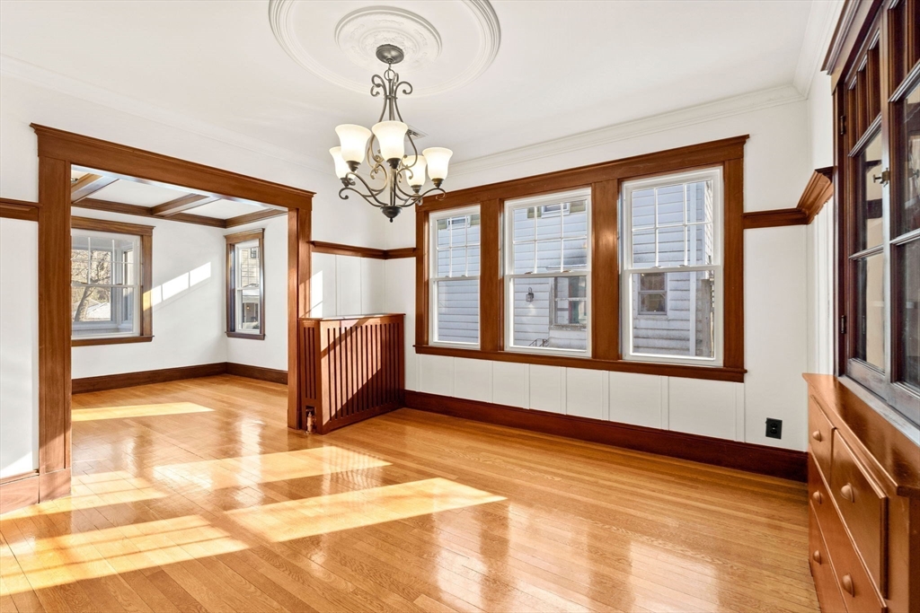 27 Hawthorn Road Milton, MA 02186 - Photo 7 of 26 a view of an empty room with a window and a kitchen