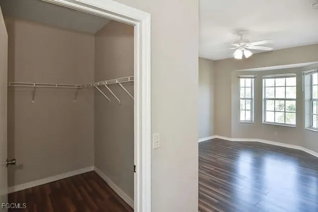 a view of livingroom with hardwood floor and ceiling fan