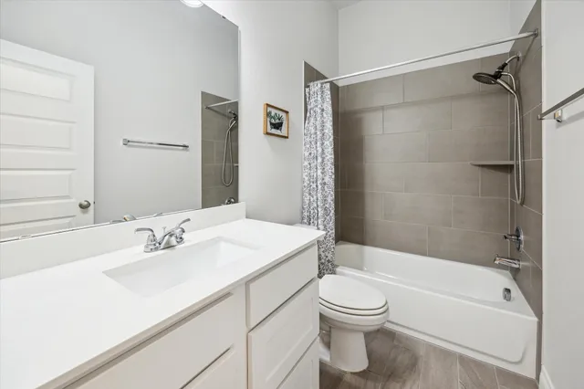 a bathroom with a sink a toilet and a bathtub