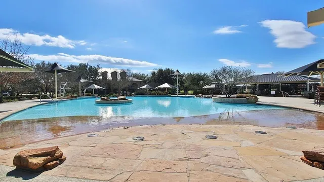 a view of an outdoor space with swimming pool