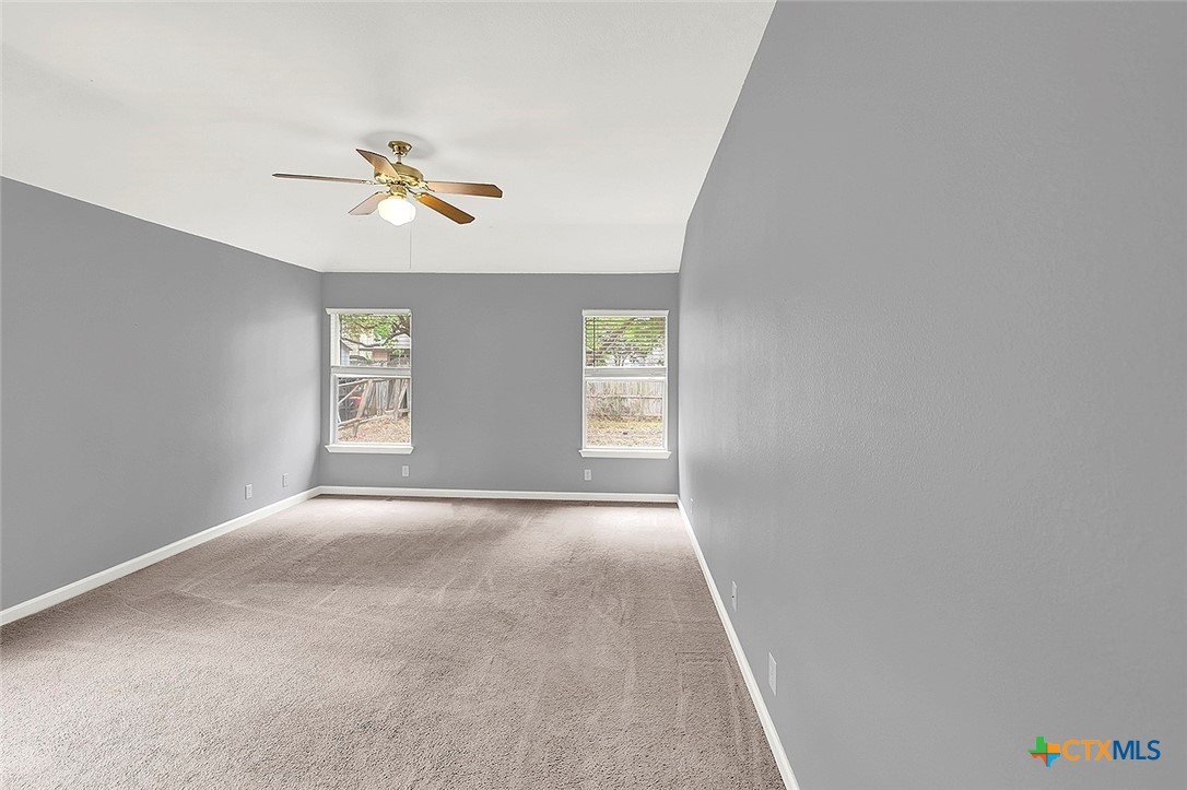 140 Riley Cove Kyle, TX 78640 - Photo 15 of 26 a view of an empty room with a window