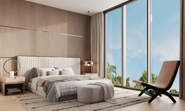 a bedroom with bed and a chair