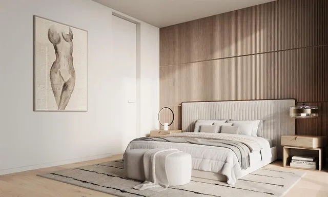 a bedroom with a bed and a night stand