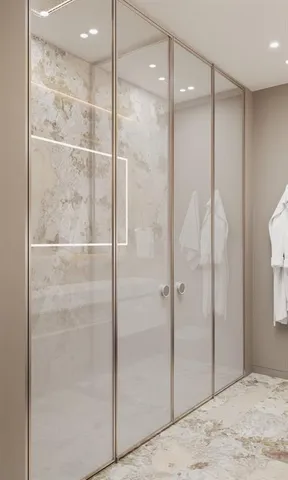 a bathroom with a shower and a glass door
