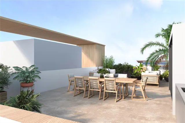 a view of a backyard with a garden and patio