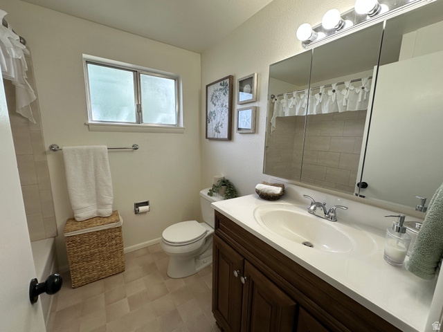 624 East Cutler Springville, UT 84663 - Photo 23 of 24 Upstairs bathroom featuring a wood-finish vanity with an integrated sink, a mirrored medicine cabinet, and overhead vanity lighting