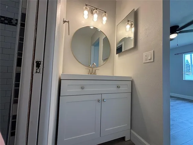 a bathroom with a mirror and a sink