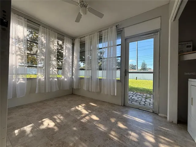 a view of a hallway with a livingroom view