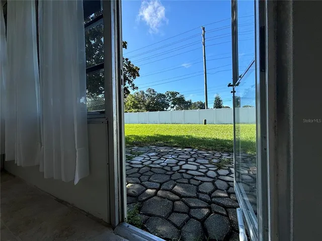 a view of a porch with a big yard