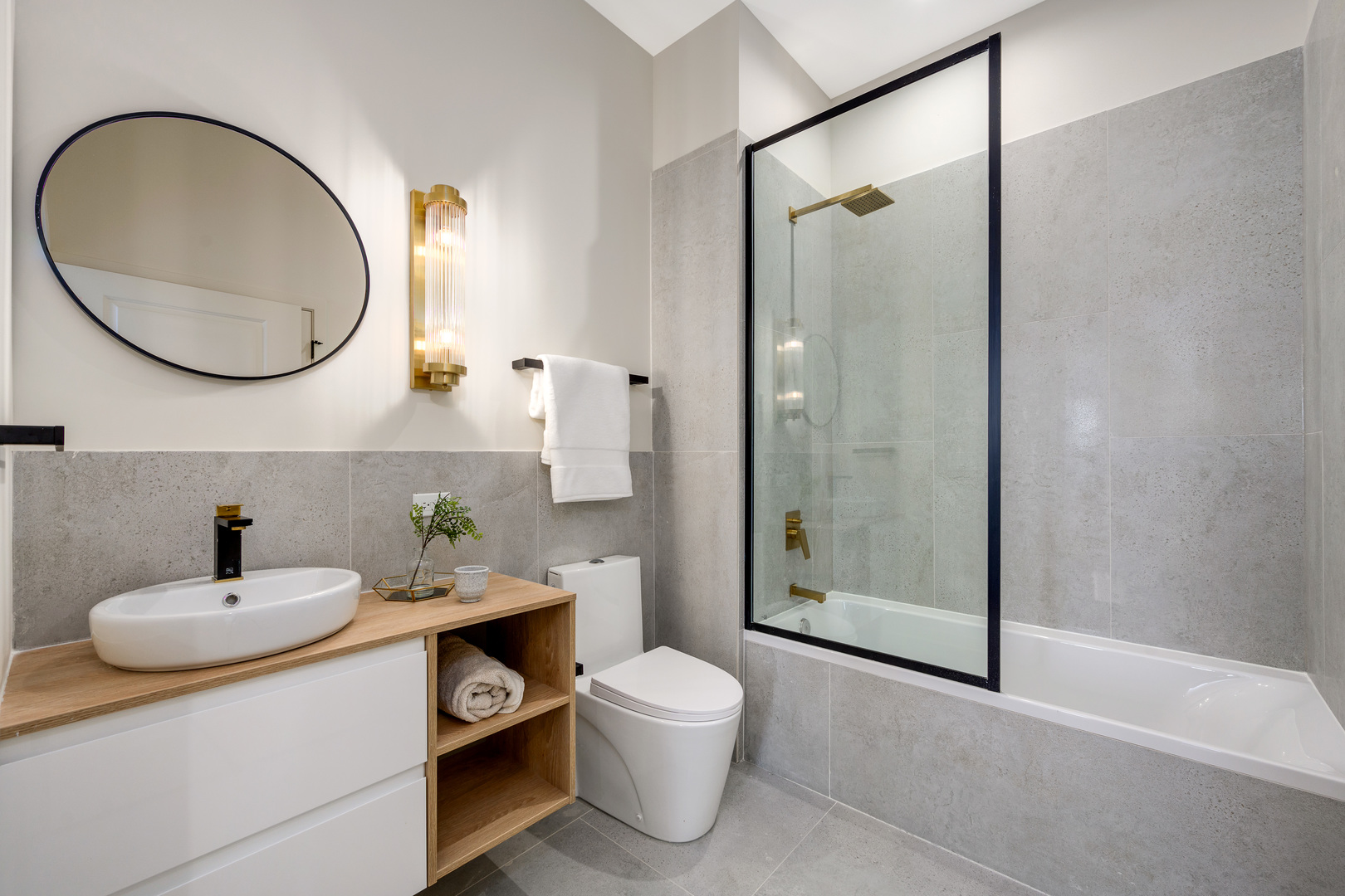 11 West Prospect Avenue, Unit 415 Mount Prospect, IL 60056 - Photo 14 of 62 a bathroom with a sink a toilet and a mirror