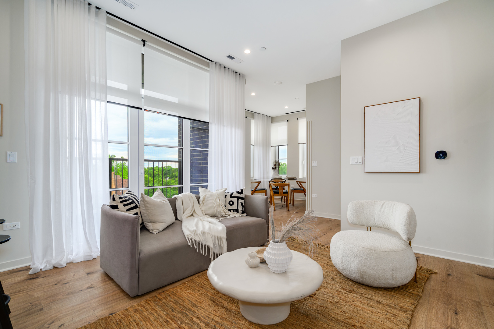 11 West Prospect Avenue, Unit 415 Mount Prospect, IL 60056 - Photo 8 of 62 a living room with furniture and a large window