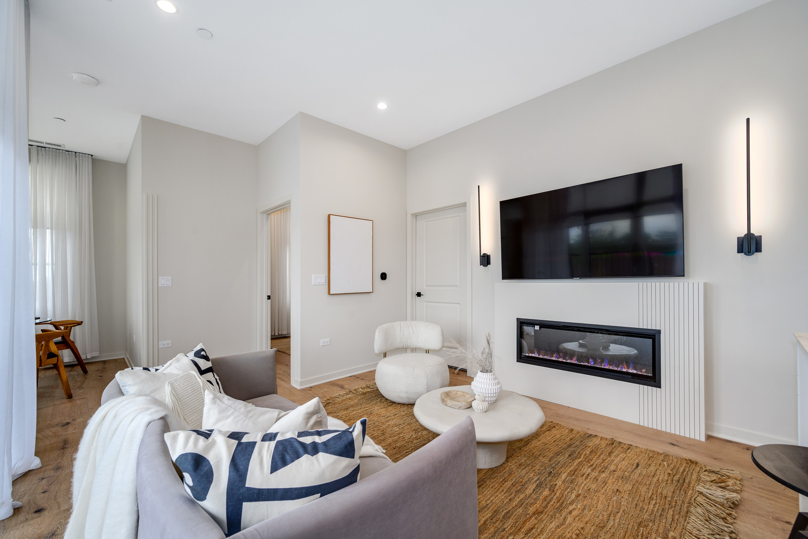 11 West Prospect Avenue, Unit 415 Mount Prospect, IL 60056 - Photo 9 of 62 a living room with furniture and a flat screen tv