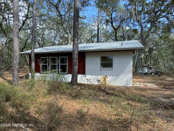 a house with trees in the background