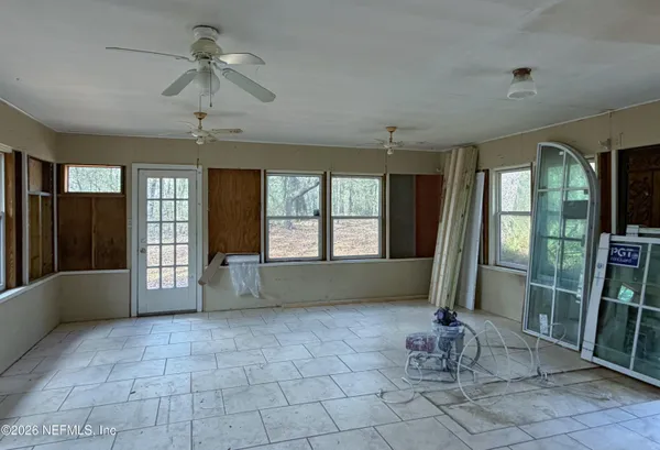 a living room with hardwood floor and furniture