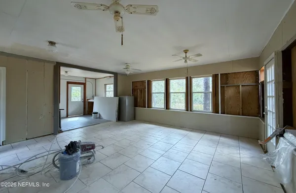 a view of an empty room and window
