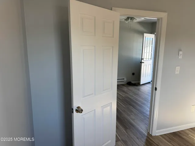 a view of a bathroom from a hallway