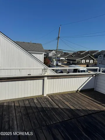 a view of balcony with wooden floor