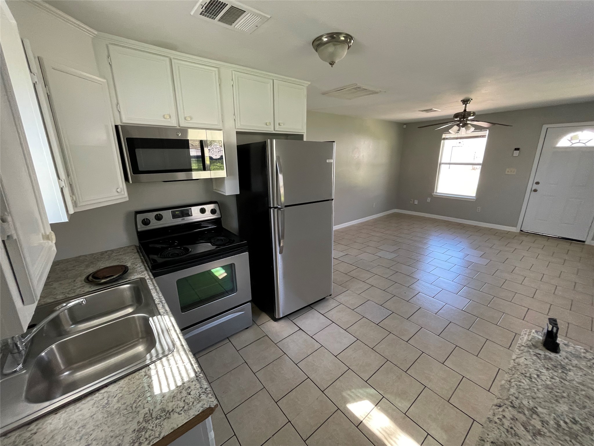 1041 Lott Avenue Austin, TX 78721 - Photo 5 of 14 a kitchen with a refrigerator and a stove